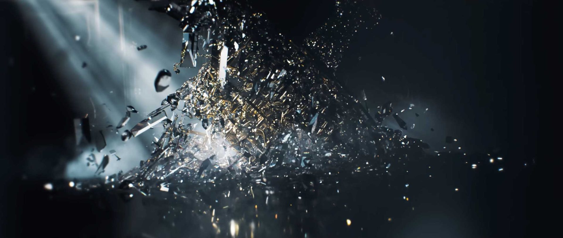 Shards of glass dramatically shatter and scatter in midair, illuminated by focused beams of light—evoking a striking Game Title Sequence worthy of 007—against a dark, blurred background. Frame from Stash Magazine article.