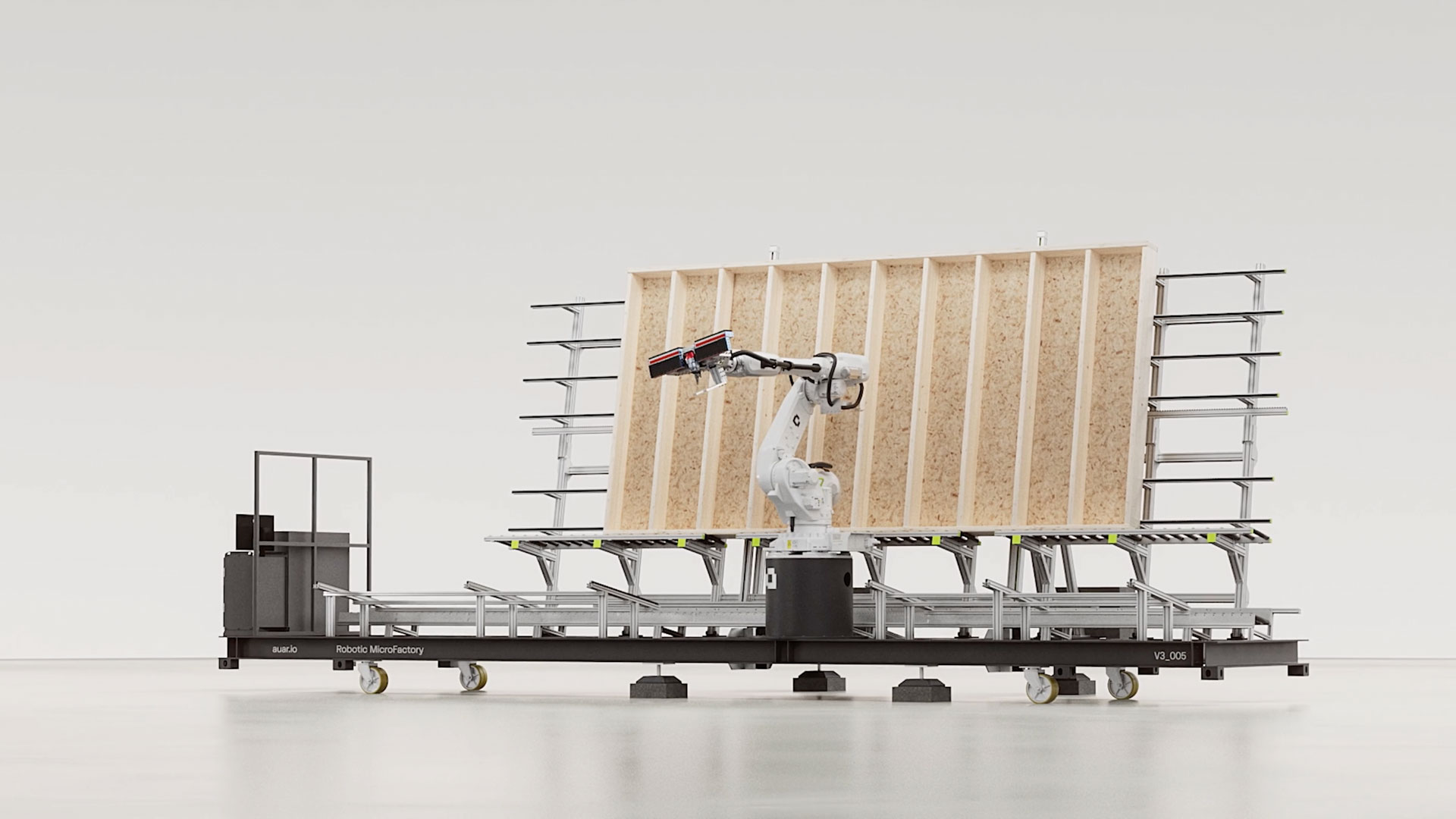 A robotic arm from AUAR assembles or inspects a large wooden frame standing upright on a mobile platform in a clean, minimal Robot MicroFactories industrial setting. Frame from Stash Magazine article.