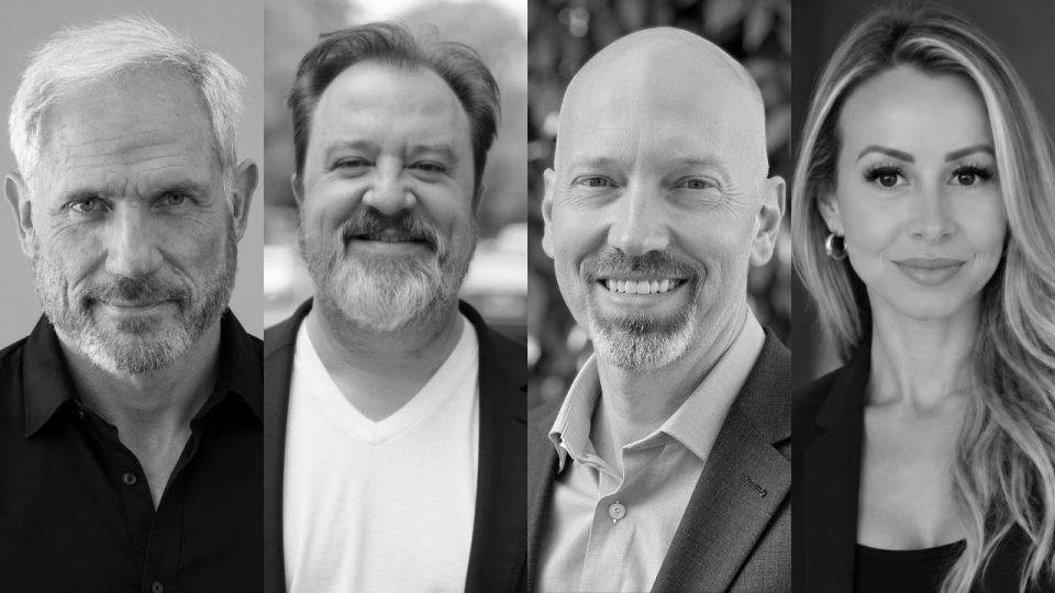 Four adults, three men and one woman, are shown in black and white portrait photos. They are all smiling and wearing business or smart casual attire, posed against neutral or blurred backgrounds. Frame from Stash Magazine article.