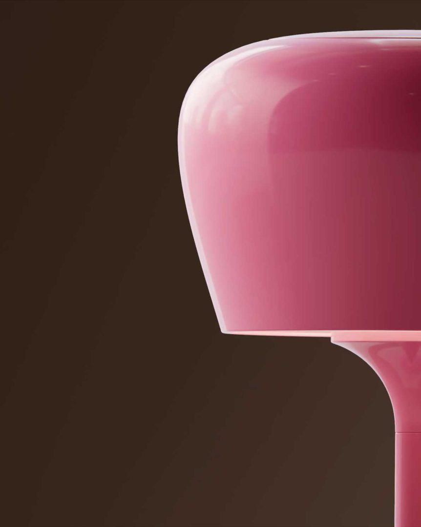 Close-up of a modern pink lamp with a glossy finish, positioned on the right side of the image against a solid dark brown background, evoking the sleek aesthetic seen in Andreas Wannerstedt’s mesmerizing short film animations. Frame from Stash Magazine article.