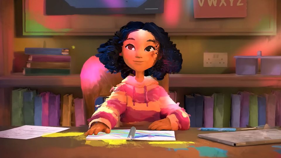 A girl with curly dark hair wearing a pink striped sweater sits at a desk, drawing with colored pencils. The warmly lit, colorful room—filled with books and papers—captures the spirit of Art&Graft’s creative world. Frame from Stash Magazine article.