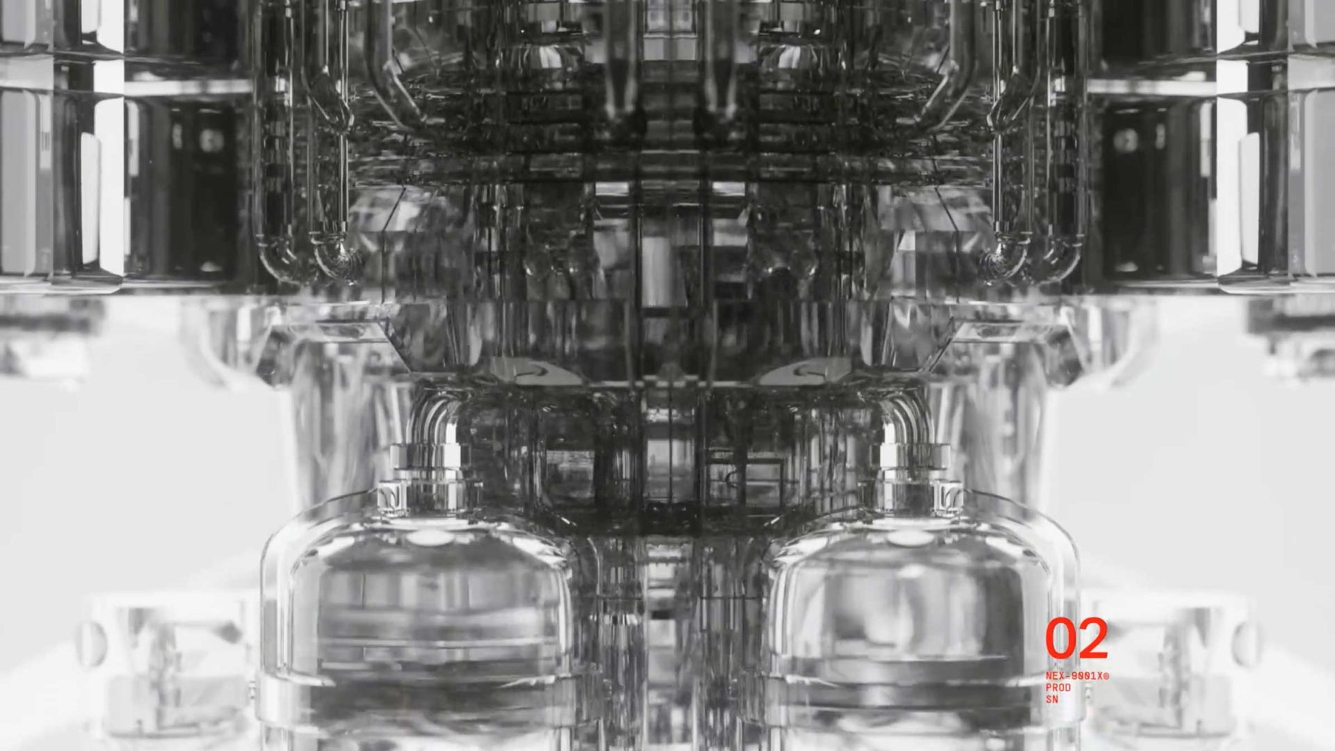 Close-up of a complex, symmetrical, metallic and glass-like machine structure with reflective surfaces. The background is white, featuring a small red 02 and text in the bottom right corner referencing Artifex Creatura by Joan Moreno. Frame from Stash Magazine article.