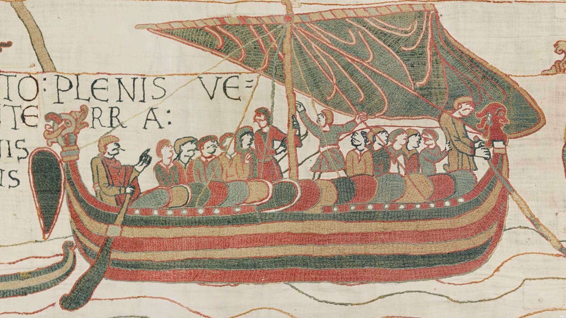 Medieval embroidery shows a group of people in a decorated boat with striped sail, rowing and sailing, from the Bayeux Tapestry—a scene reimagined in the acclaimed Bayeux Tapestry film for the British Museum by Hocus Pocus. Frame from Stash Magazine article.