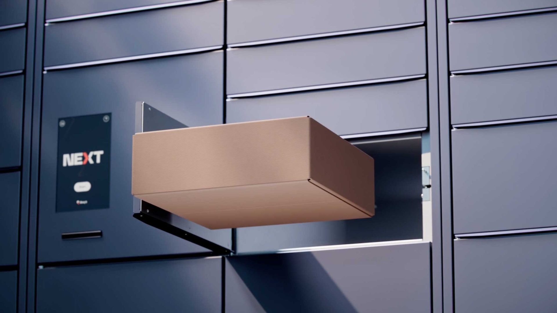 A brown package extends from an open compartment in a sleek, modern Bloq.it locker system labeled NEXT. The lockers have a metallic blue finish with horizontal lines, while the depth of field highlights their contemporary design. Frame from Stash Magazine article.