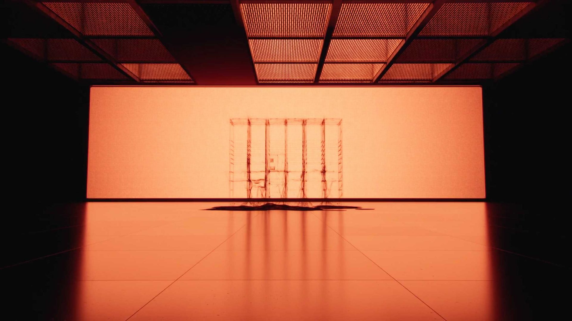 A large, empty room glows orange from a backlit screen. At the center, transparent smart lockers cast long shadows on the shiny floor. The ceiling has grid panels, adding to the minimal and futuristic feel with striking depth of field. Frame from Stash Magazine article.