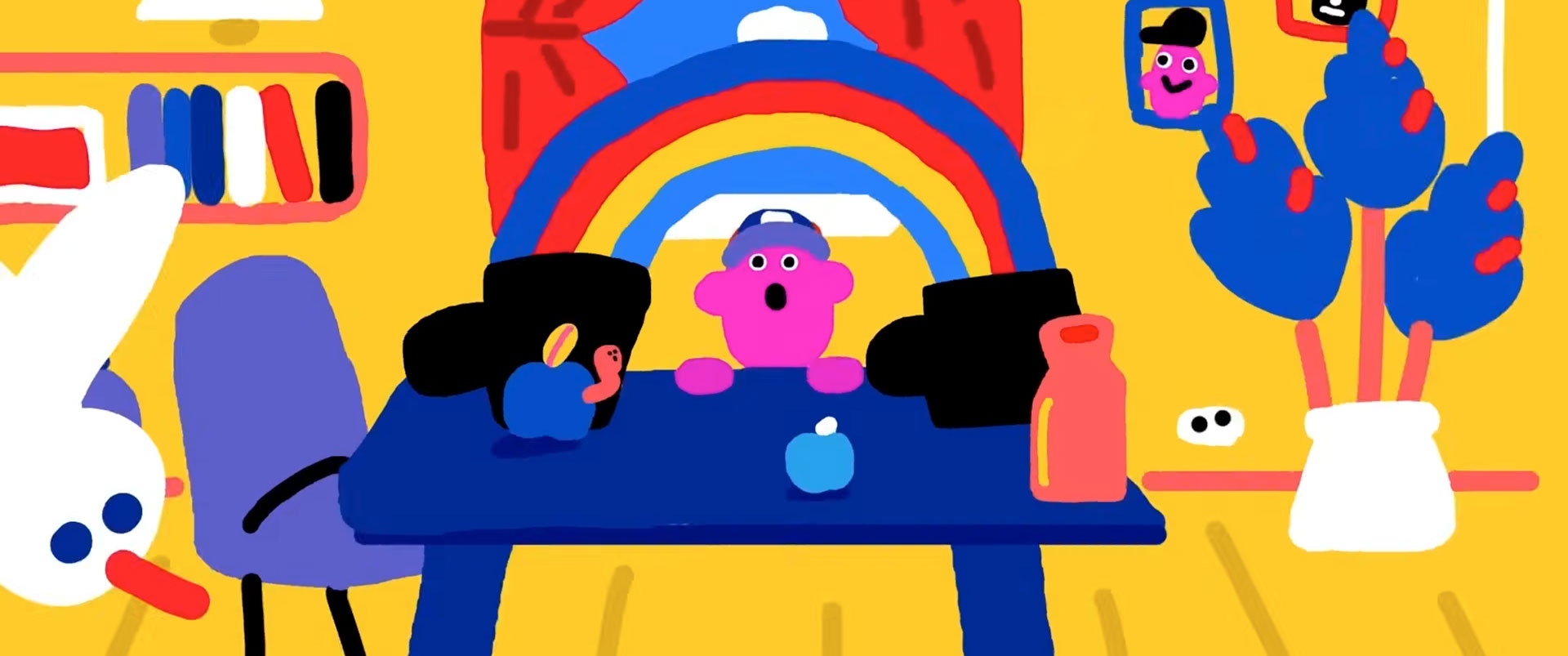 A colorful cartoon drawing inspired by Breaking-Into-Animation-14-Tips-for-Junior-Applicants-by-Rachel-Ashley, featuring a pink character at a blue table with fruit, bright objects, rainbows, cheerful faces, and red-curtained window. Frame from Stash Magazine article.
