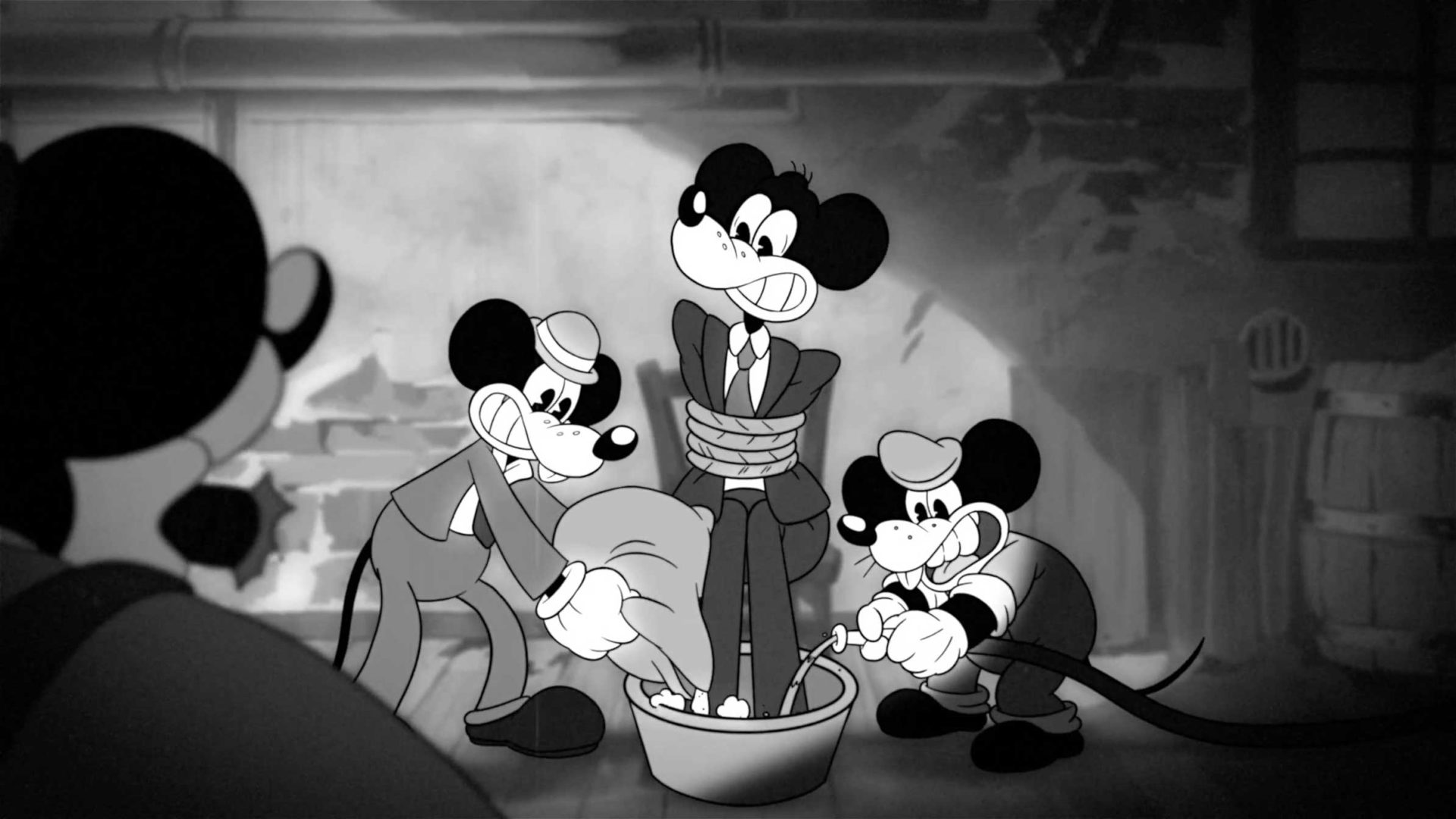 Three cartoon mice in old-fashioned clothing enact a classic Gangster Life scene: two dunk a third, tied up in a suit, into a bucket of water while another mouse watches from the left. Frame from Stash Magazine article.