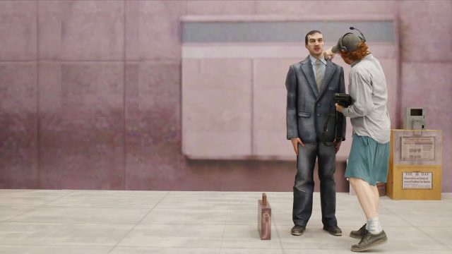 Two men stand on a sidewalk; one in a suit with an awkward posture, the other in casual clothes and a headset, interacting with a device, like modern-day NPCs. In the background, a Coinbase ATM and newspaper box sit against a concrete wall.