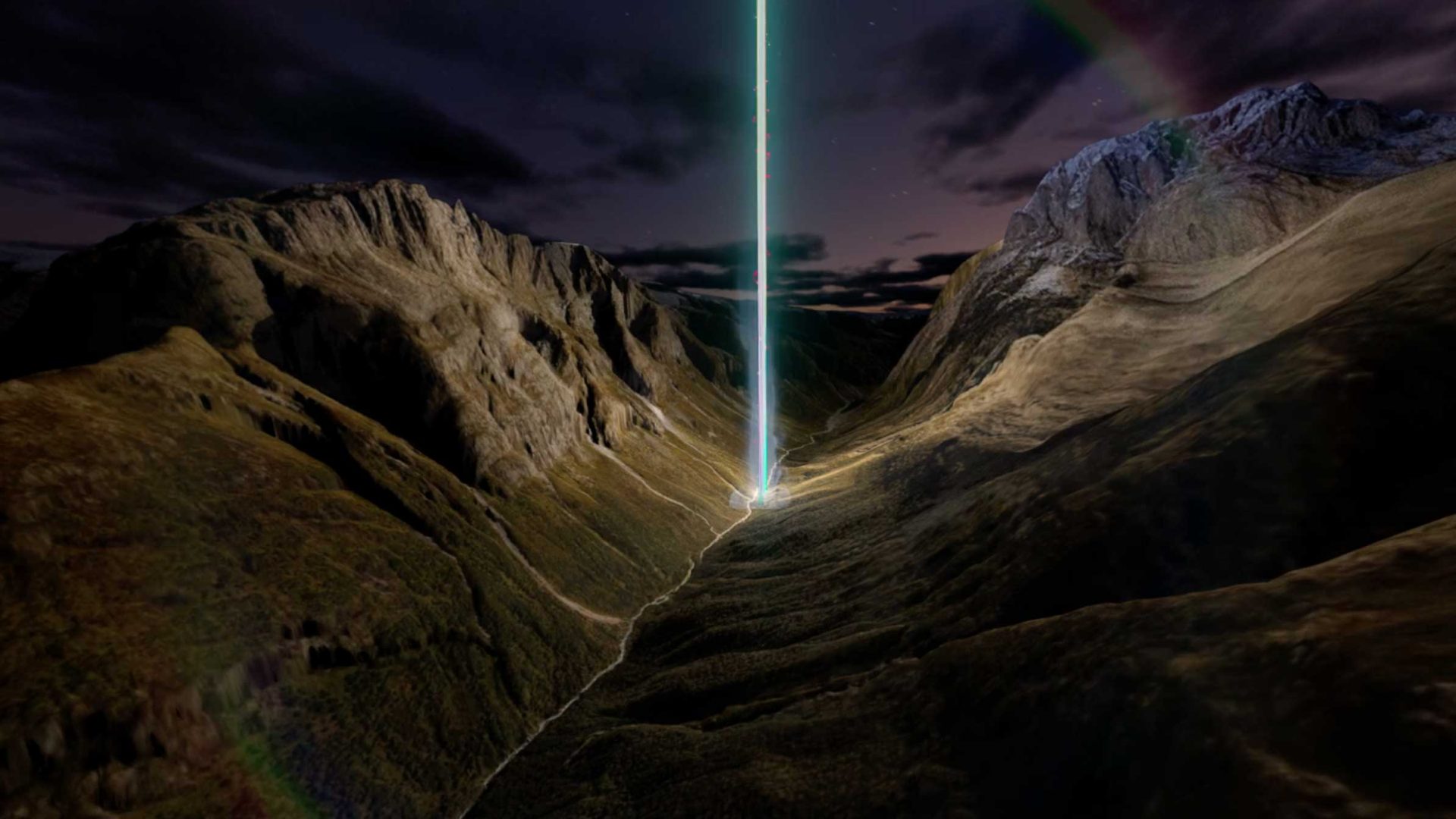 A bright vertical beam of light, part of the DEEP GEO Sound & Light experience, shoots into the night sky from a valley surrounded by rugged mountains, with clouds and dark sky overhead. Frame from Stash Magazine article.