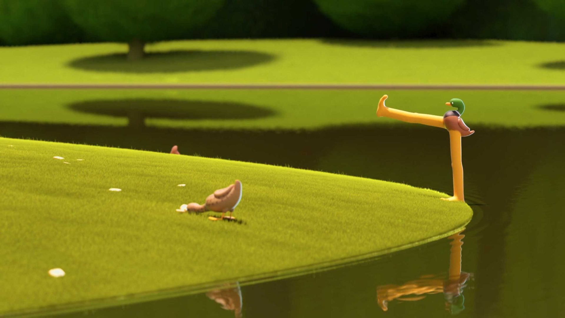 A cartoonish duck, inspired by AJ Jefferies’ DUCKS short film, stands on the edge of a pond with an abnormally long, straight leg stretching over the water and trees blurred in the background. Frame from Stash Magazine article.