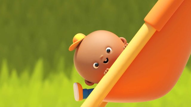 A smiling animated baby wearing a yellow cap and blue clothes peeks out from behind an orange slide, with a blurred green background, in the playful style of DUCKS Short Film by AJ Jefferies. Frame from Stash Magazine article.