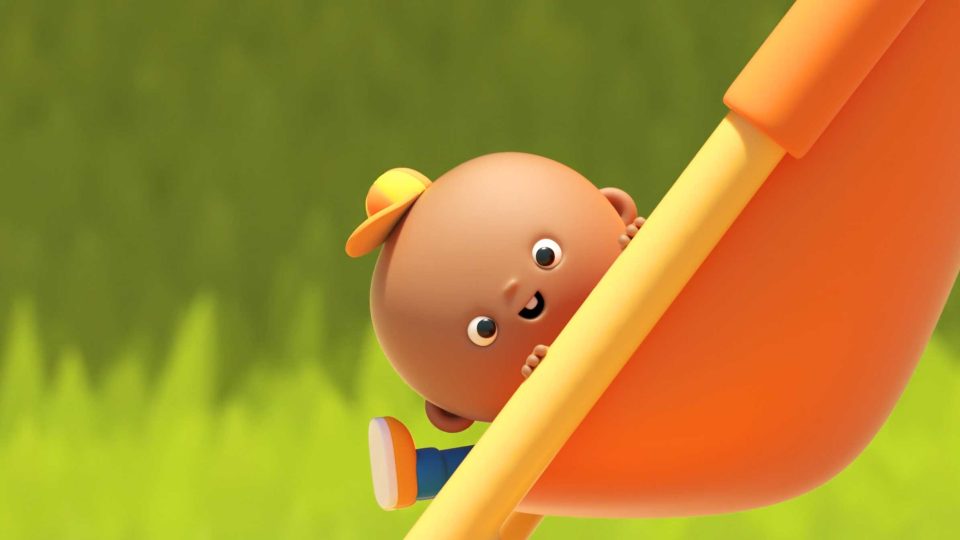 A smiling animated baby wearing a yellow cap and blue clothes peeks out from behind an orange slide, with a blurred green background, in the playful style of DUCKS Short Film by AJ Jefferies. Frame from Stash Magazine article.