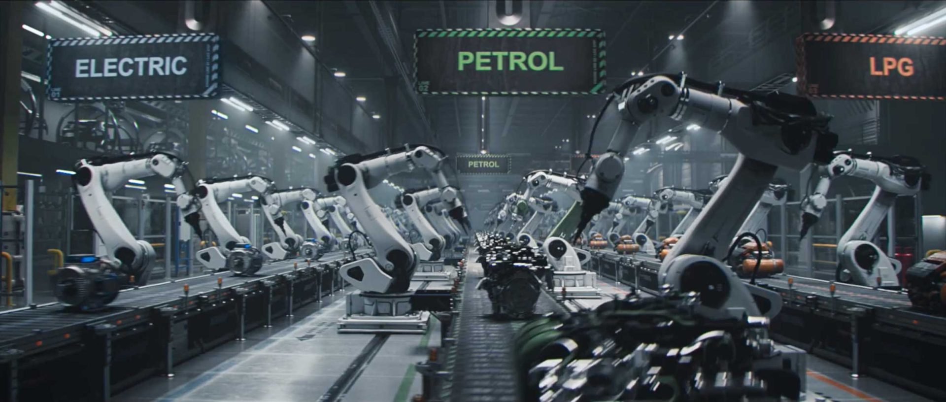 Robotic arms assemble car engines on a factory production line, with overhead signs reading ELECTRIC, PETROL, and LPG indicating different assembly areas—a scene reminiscent of the precision showcased in the Dacia Robots commercial by Romain Chassaing. Frame from Stash Magazine article.