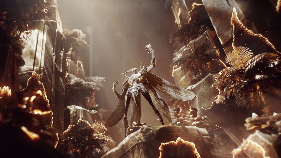 A majestic, insect-like humanoid figure stands triumphantly atop a rocky ledge, bathed in golden light, surrounded by lush, glowing foliage and towering rock formations—an unforgettable scene reminiscent of an epic trailer for Endless Legend 2. Frame from Stash Magazine article.