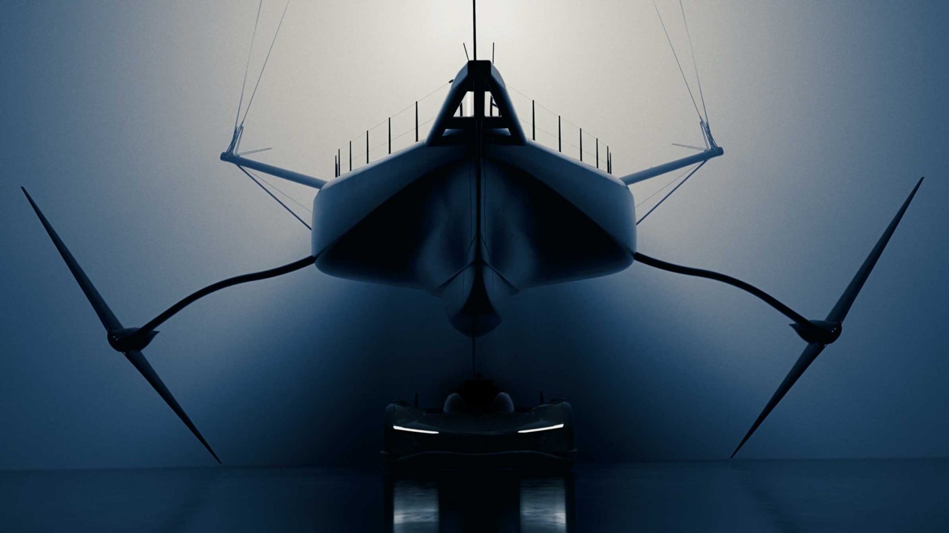 A futuristic, sleek Hypersail boat with large curved supports and propellers is shown head-on in dramatic lighting at Milan Design Week, casting shadows on a smooth surface below. Frame from Stash Magazine article.