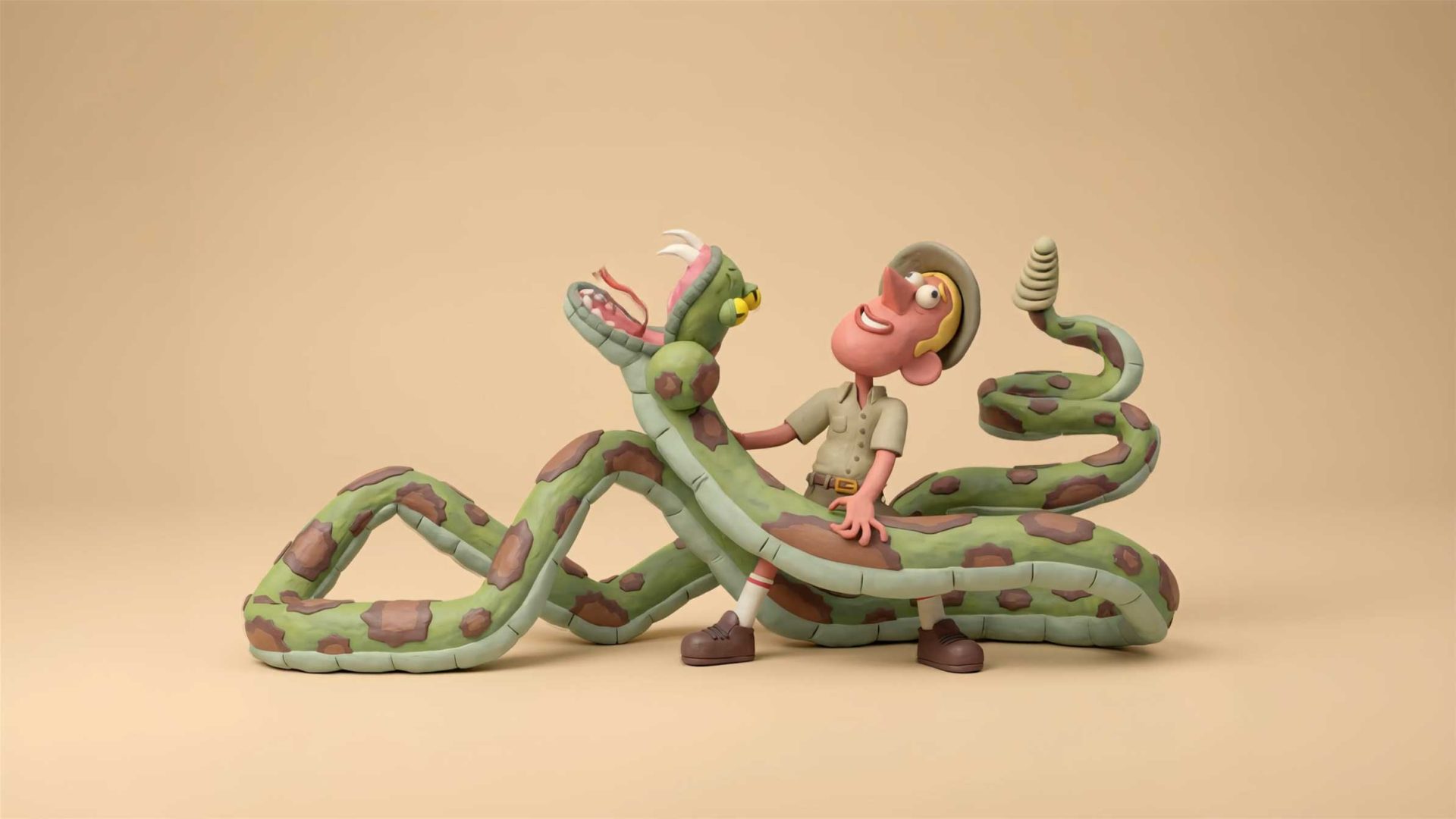 A smiling cartoon explorer in safari clothes stands cheerfully as a large green and brown snake wraps around him, lifting its head near his face. This playful Jamute scene unfolds against a plain beige background. Frame from Stash Magazine article.