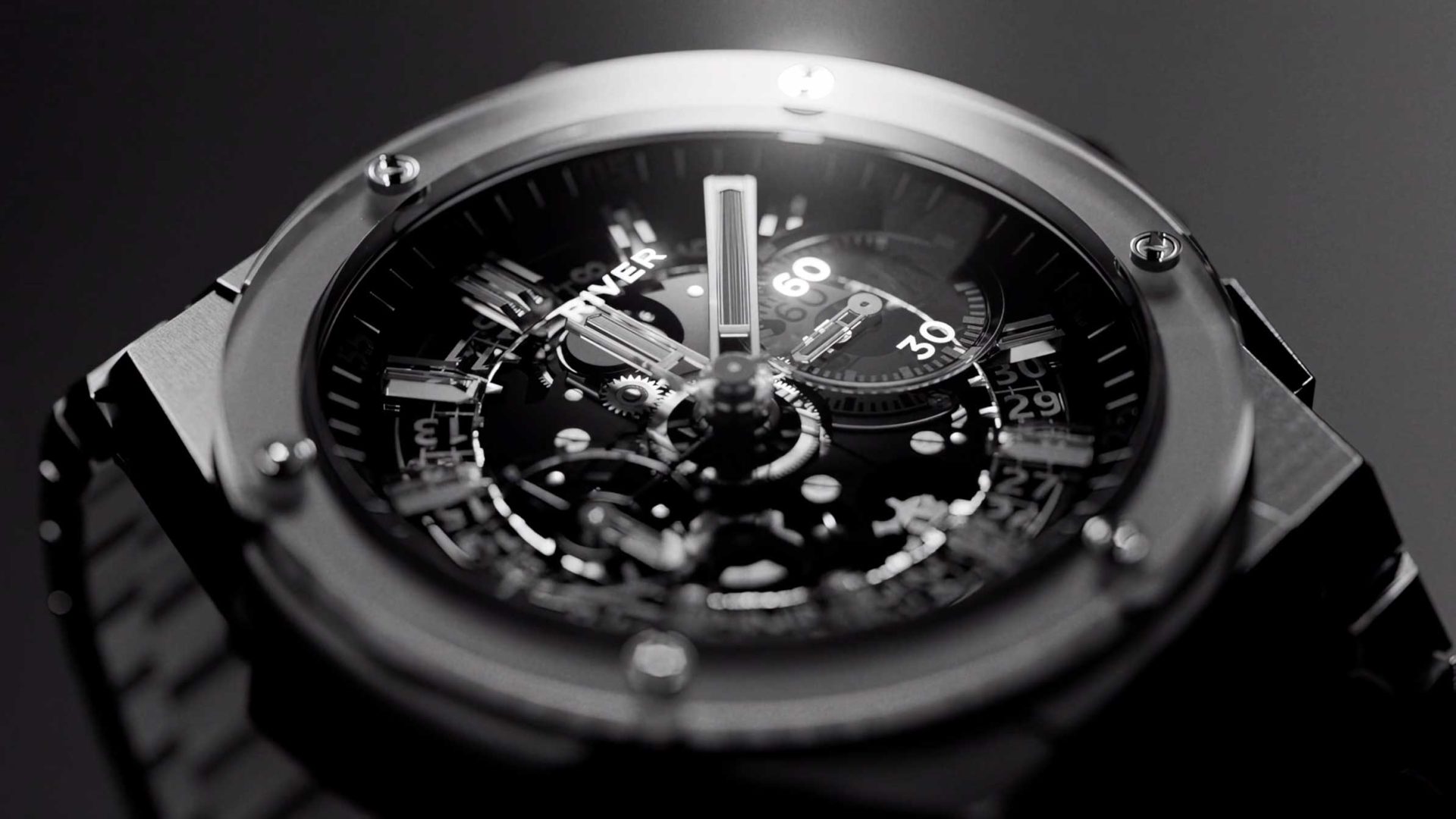 Close-up of a Jellyfish-style skeletonized chronograph watch with a black dial and visible Studio River gear movement. Frame from Stash Magazine article.