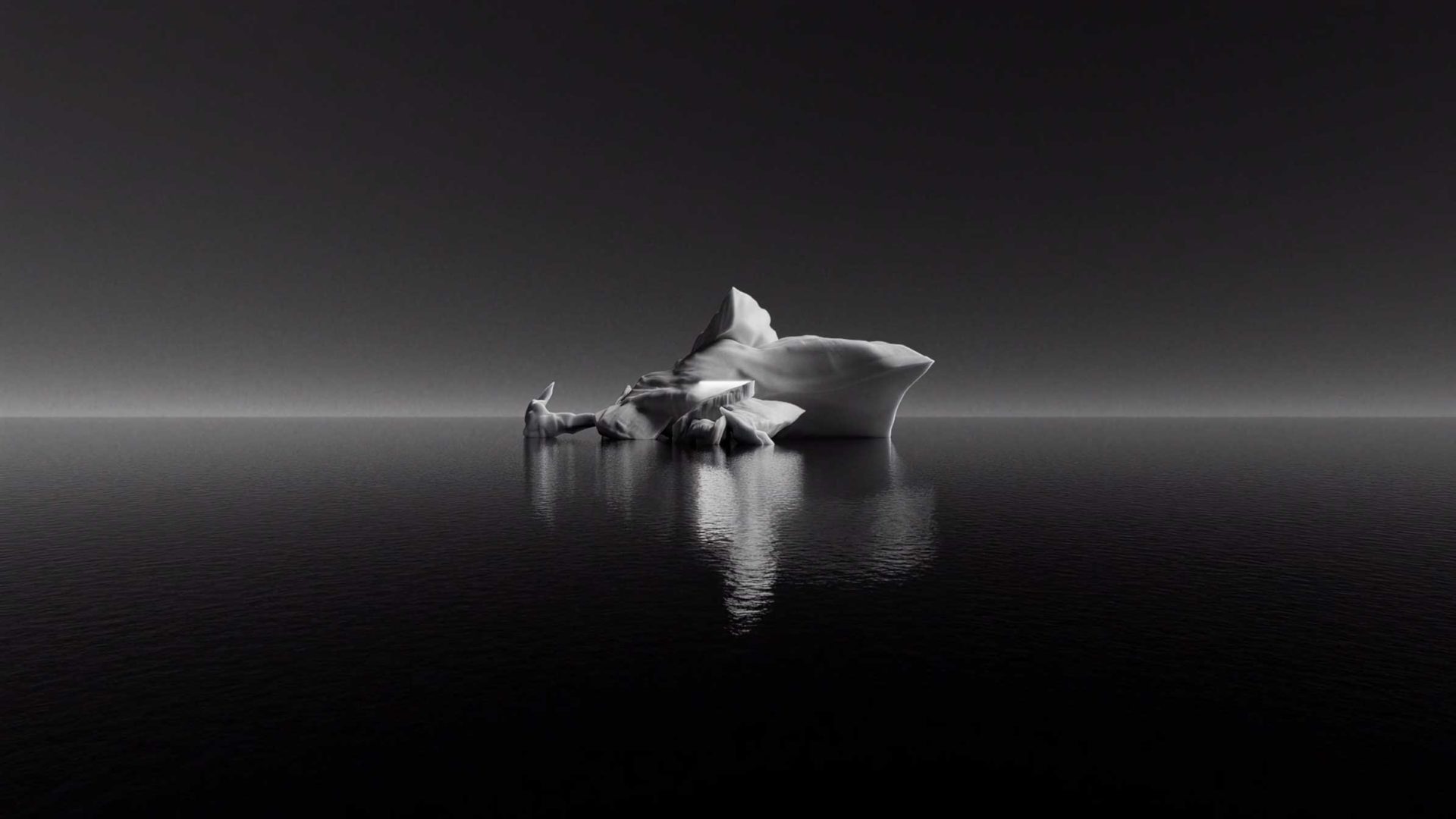 A lone iceberg floating in calm, dark water, captured for a Hublot CG spec spot by Studio River. Frame from Stash Magazine article.