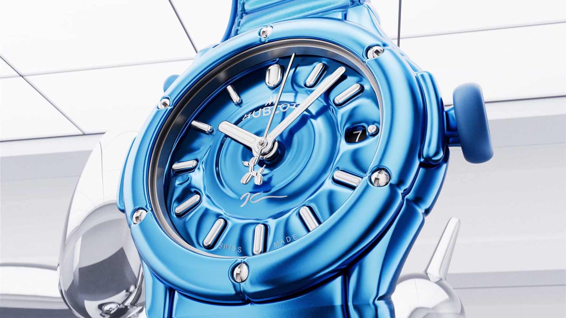 Close-up of a shiny, metallic blue wristwatch with silver hour markers and hands, set against a modern, bright background with reflective surfaces. Inspired by Jeff Koons’ iconic Balloon Dog sculptures, this Hublot timepiece features the fluid, sculpted design characteristic of the Classic Fusion Balloon Dog collection, seamlessly blending contemporary artistry and bold horology. Frame from Stash Magazine article.