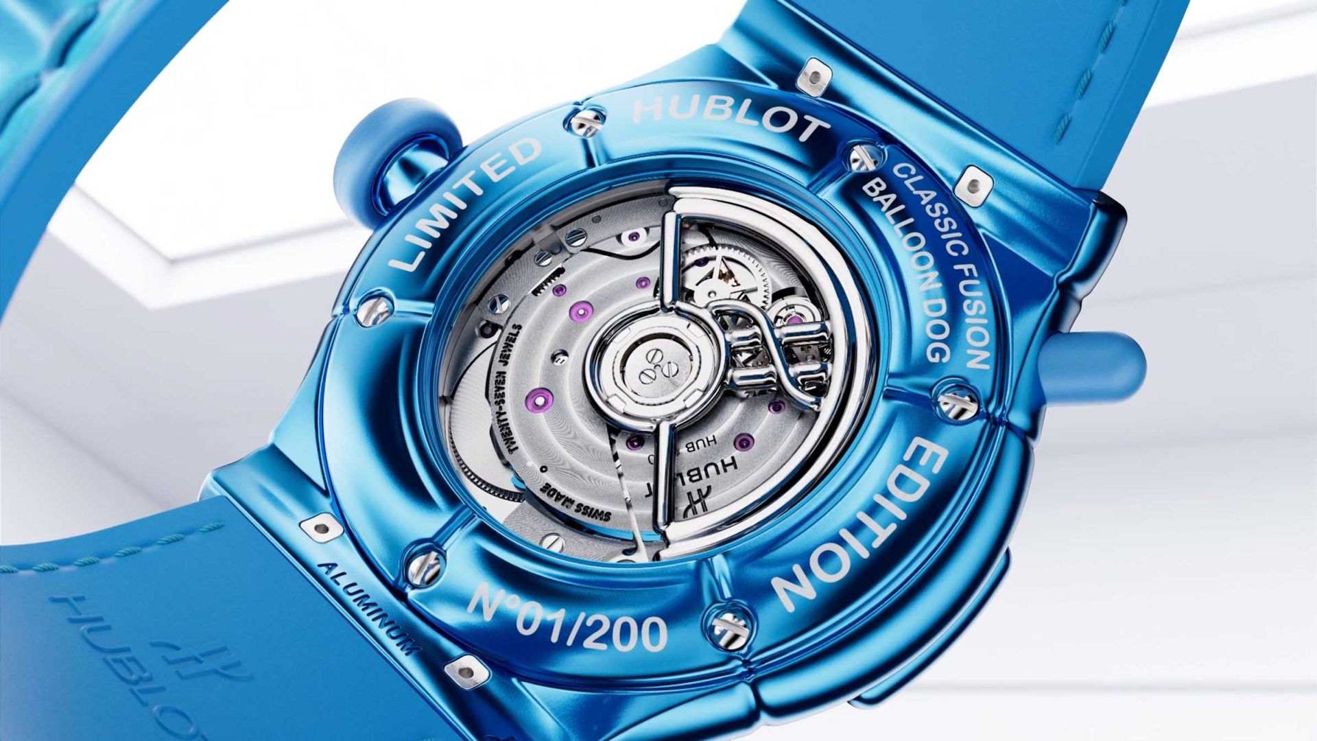 Close-up of the back of a blue Hublot Classic Fusion Balloon Dog watch, showing its exposed mechanical movement and engravings indicating it is a limited edition, numbered 01/200—a striking collaboration between Hublot and Jeff Koons. Frame from Stash Magazine article.