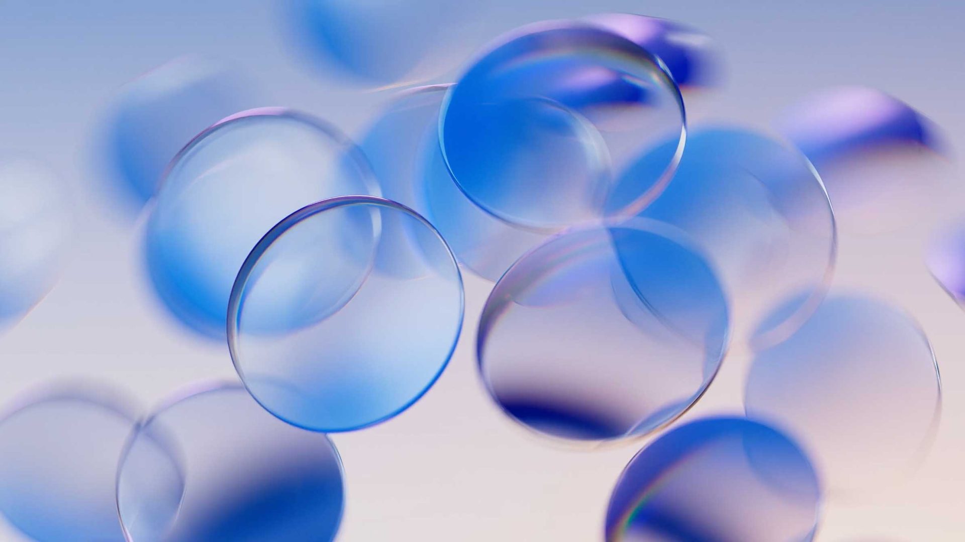 Translucent blue-tinted contact lenses float against a soft, gradient background, evoking the sleek design language found in IBM Sovereign and the innovation of Tendril Software Toolkits for an airy abstract composition. Frame from Stash Magazine article.