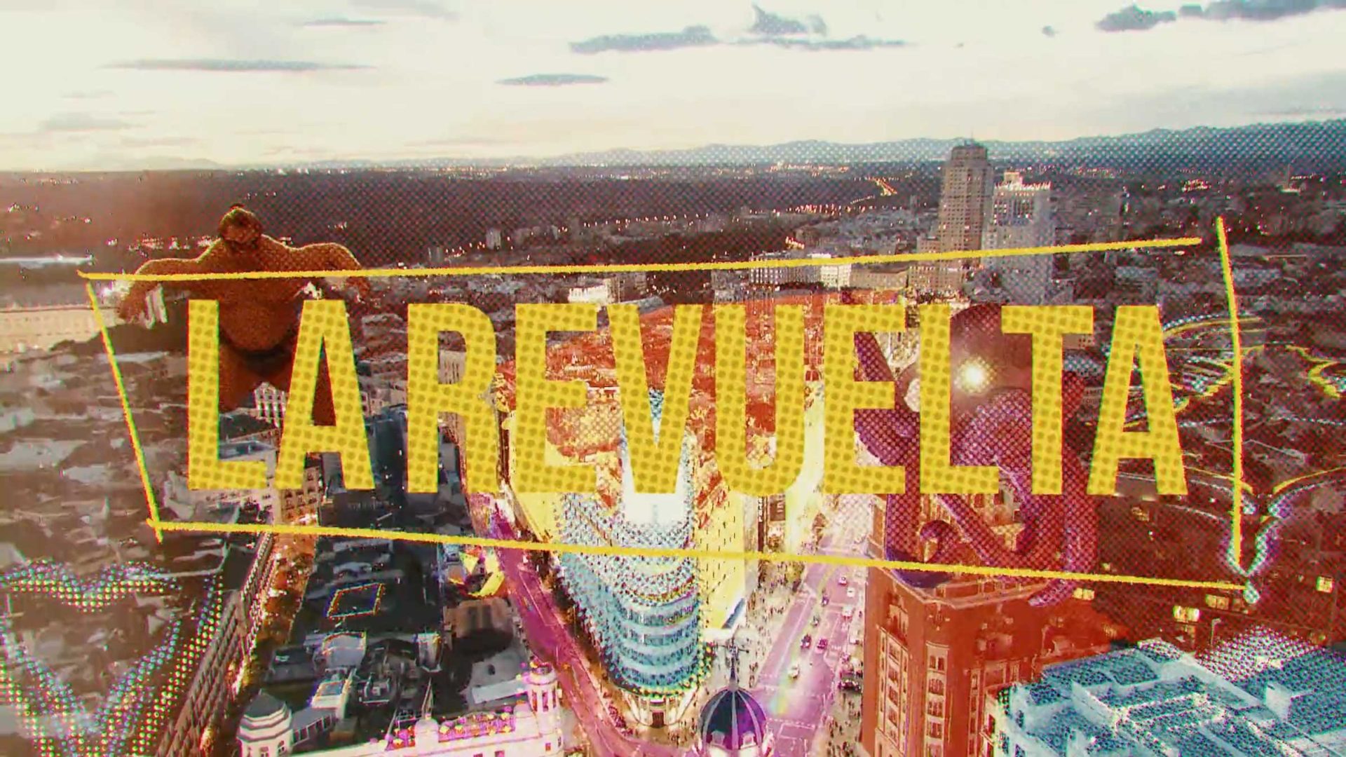 A person climbs a tall building overlooking a city at sunset, with large yellow text reading LA REVUELTA across the image—a striking visual by Fernando Marcilla. Frame from Stash Magazine article.