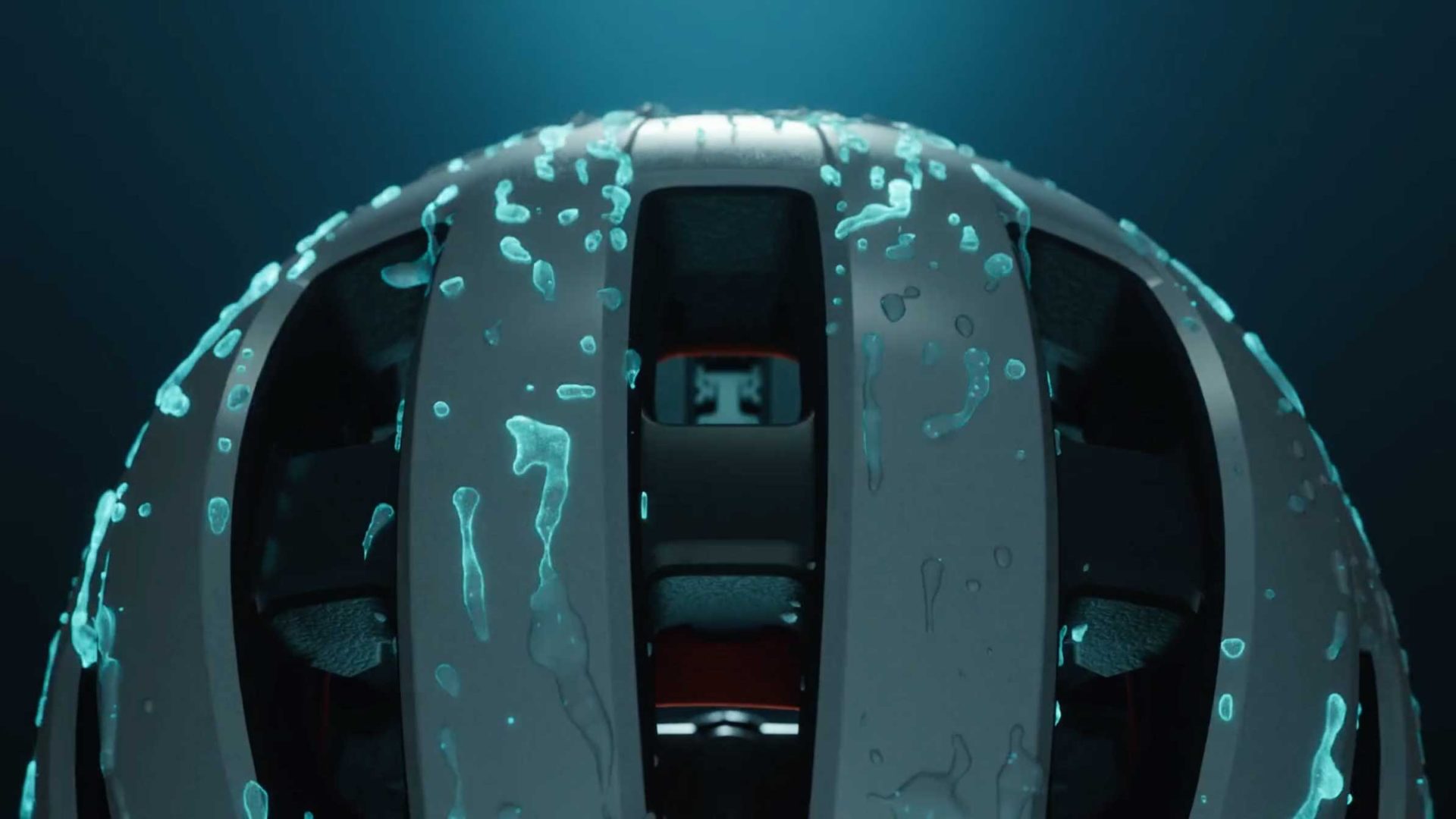 Close-up of a ventilated Lazer helmet with water droplets on its surface, illuminated by blue light from above, creating a dramatic and sleek Frame48-inspired appearance. Frame from Stash Magazine article.