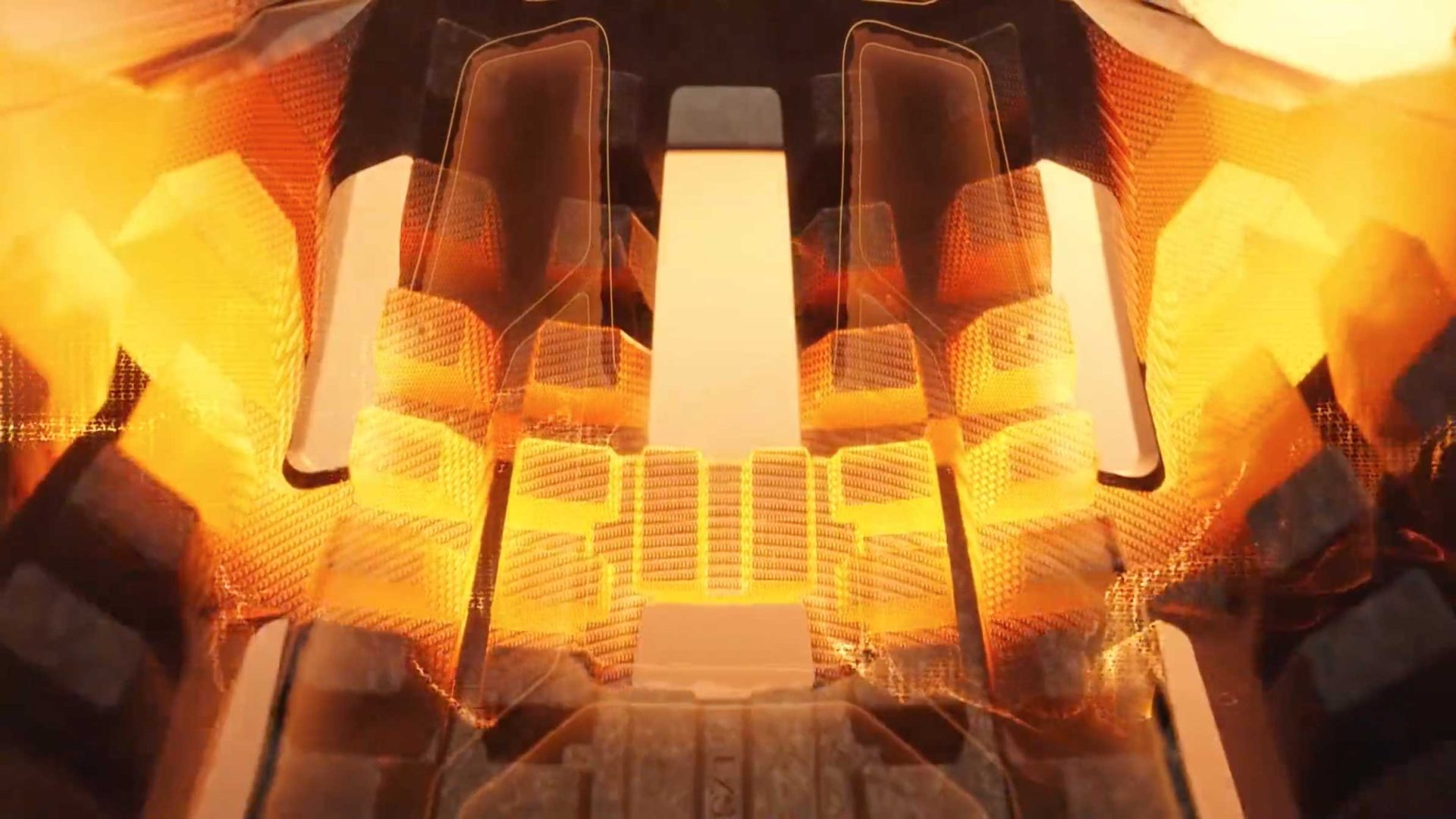 Abstract image with glowing orange and yellow light patterns resembling lazer energy radiating between dark, geometric structures, creating a symmetrical, futuristic, and mechanical appearance. Artwork by Frame48. Frame from Stash Magazine article.