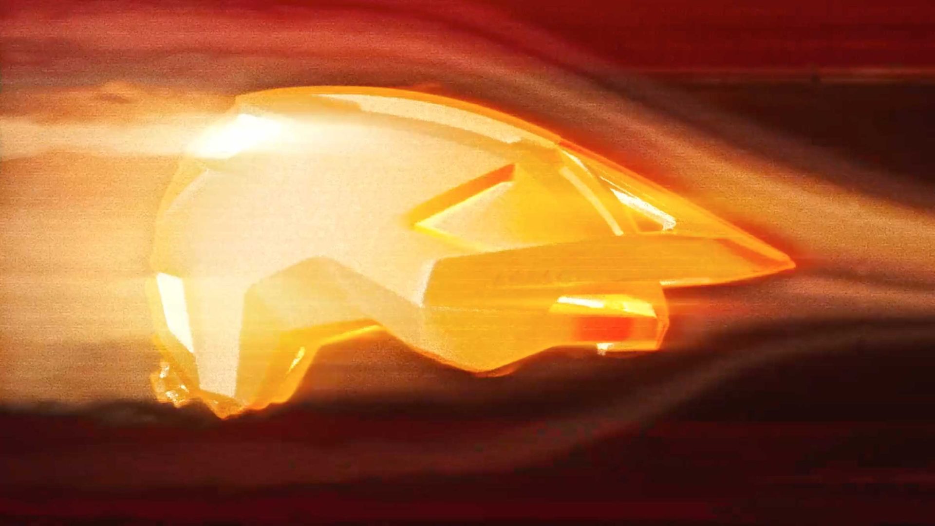 A yellow-orange bicycle helmet, featured in the Lazer Cycling Helmets product film by Frame48, is shown in a wind tunnel as air or light streams flow smoothly around it, highlighting its aerodynamic design against a dark red background. Frame from Stash Magazine article.