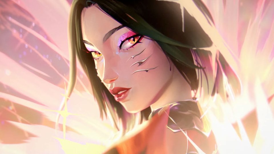 Animated portrait of a woman with dark hair, glowing orange eyes, and metallic markings on her cheeks, surrounded by the light effects of a K/DA Firestarter music video. Frame from Stash Magazine article.