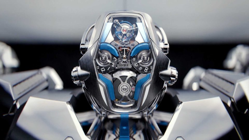 Close-up of a futuristic, intricate wristwatch inspired by the MB&F HM12 The Guardian robot time piece, with exposed gears and blue accents, featuring a transparent face showing detailed mechanical components and a modern, metallic design. Frame from Stash Magazine article.