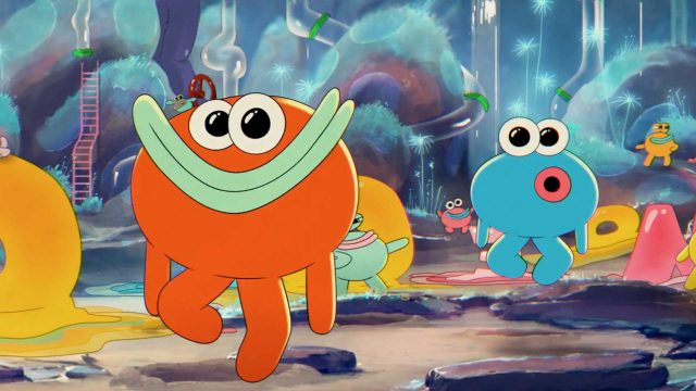 Colorful cartoon creatures with large eyes and simple shapes play in a whimsical, vibrant landscape inspired by OLIPOP's playful spirit, with abstract plants and structures in the background. The scene is lively and imaginative. Frame from Stash Magazine article.