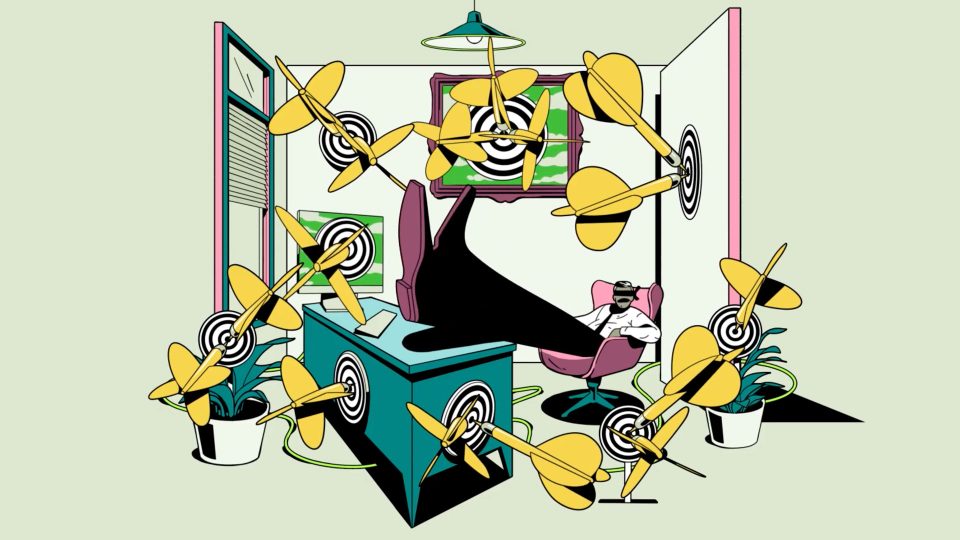 A person relaxes with feet on a desk in a colorful office, surrounded by dartboards and yellow darts hitting the bullseyes—a surreal, whimsical scene inspired by Optimizely "Tales of Mark Eting" brand films by Giant Ant. Frame from Stash Magazine article.