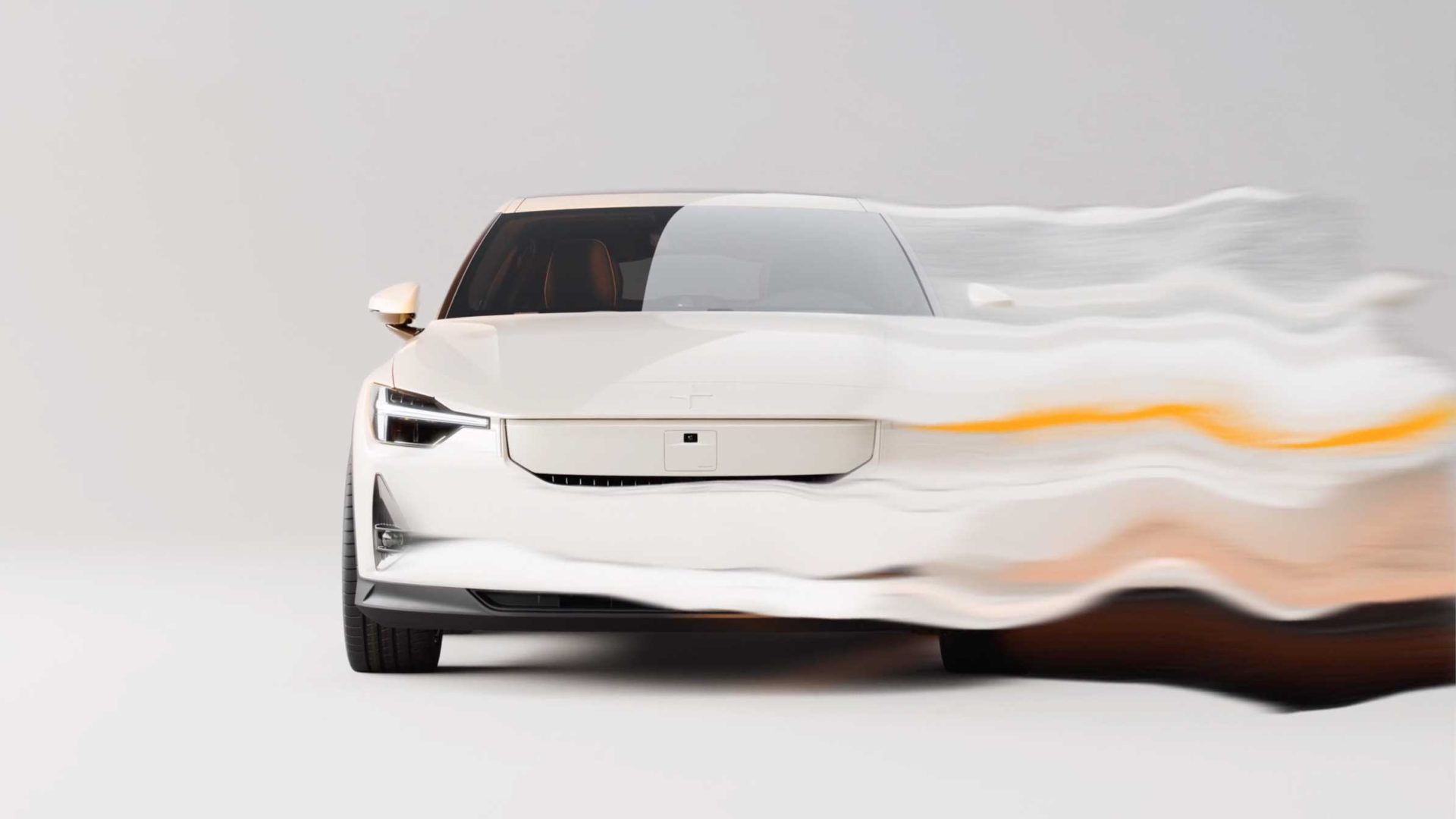 A white Polestar Prime sedan viewed from the front, with a motion-blur effect distorting the right side of the car as seen in the Brickland brand film. Frame from Stash Magazine article.