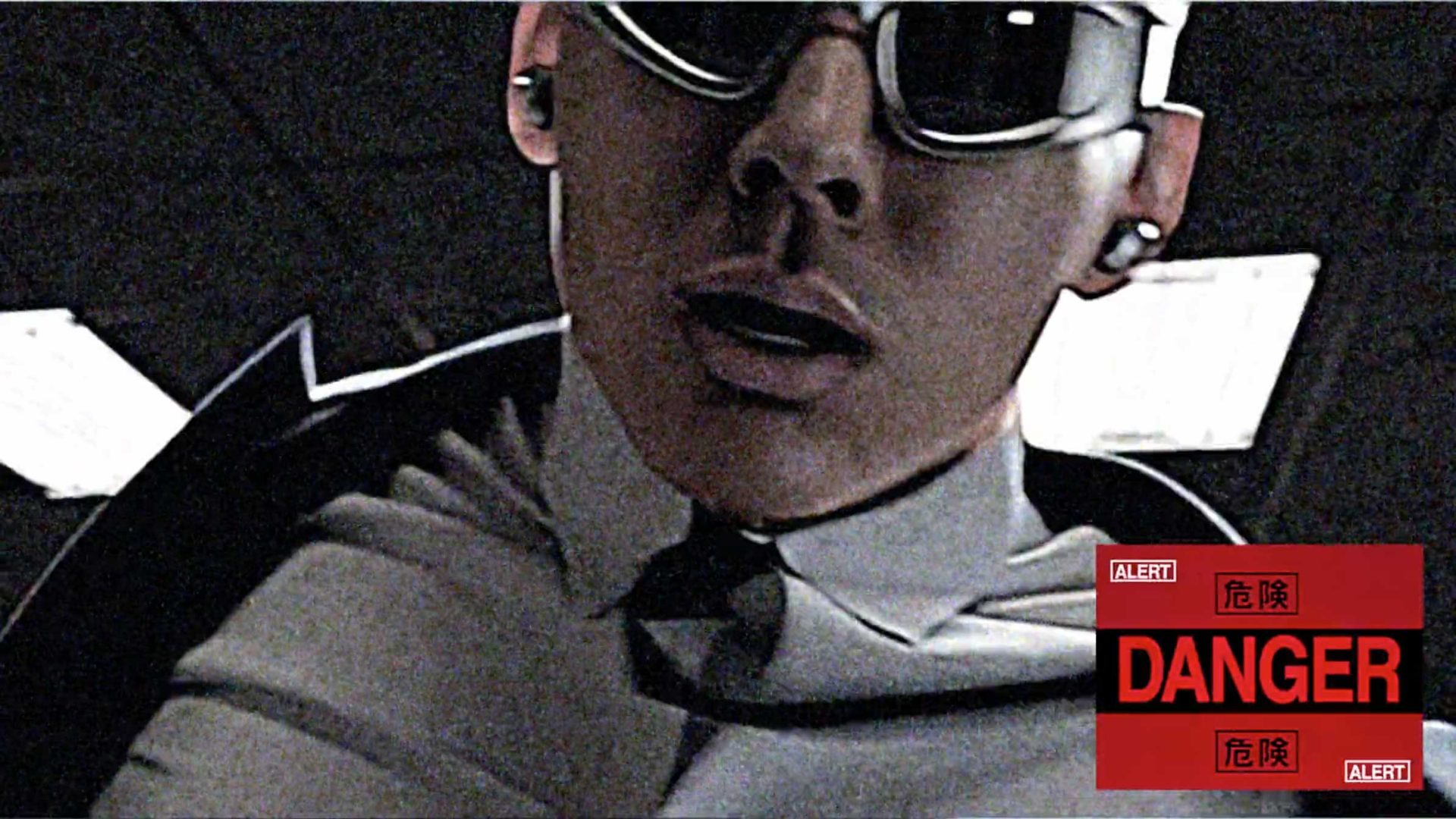 A person in sunglasses and a collared shirt looks down at the camera, evoking a mysterious mood reminiscent of Quentin Deronzier’s visual style. The image is grainy, with red DANGER and ALERT warnings in English and Chinese in the lower right corner, capturing an atmosphere akin to The Art of Losing It. Frame from Stash Magazine article.