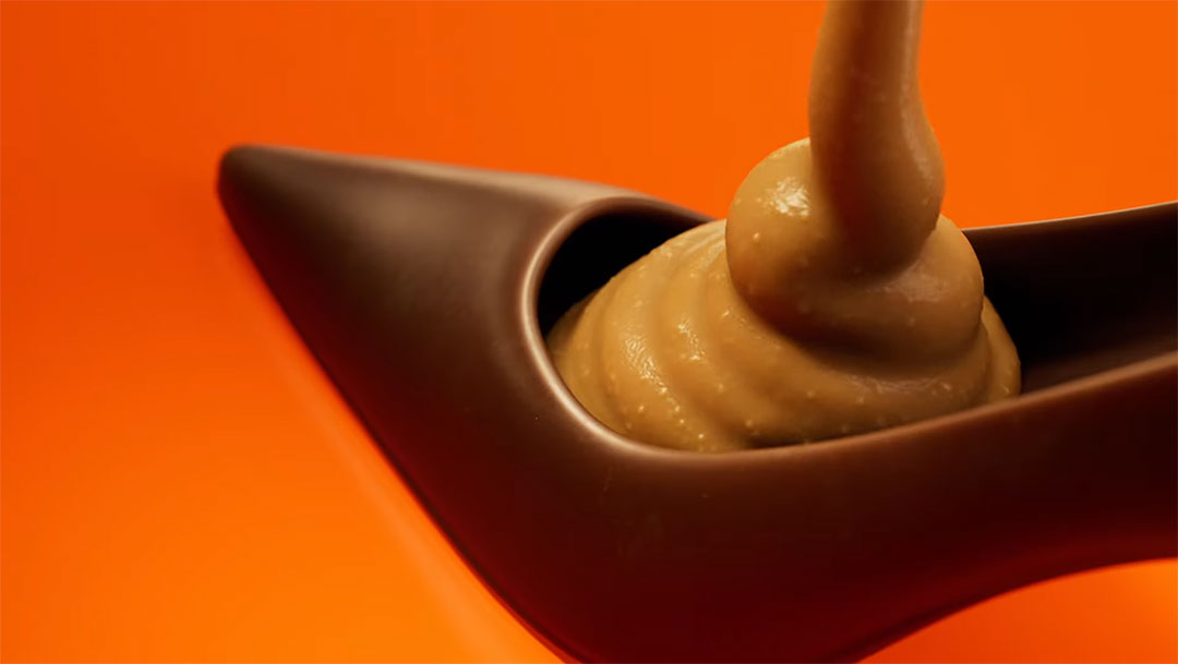 Mother fills chocolate egg with peanut butter in Reese's Easter campaign