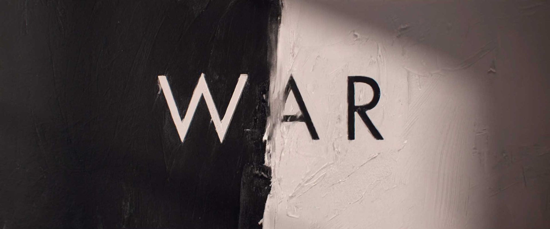 The word WAR in capital letters centered over a background split vertically between black and white, in the distinct style of Ronnie Koff for HBO. Frame from Stash Magazine article.