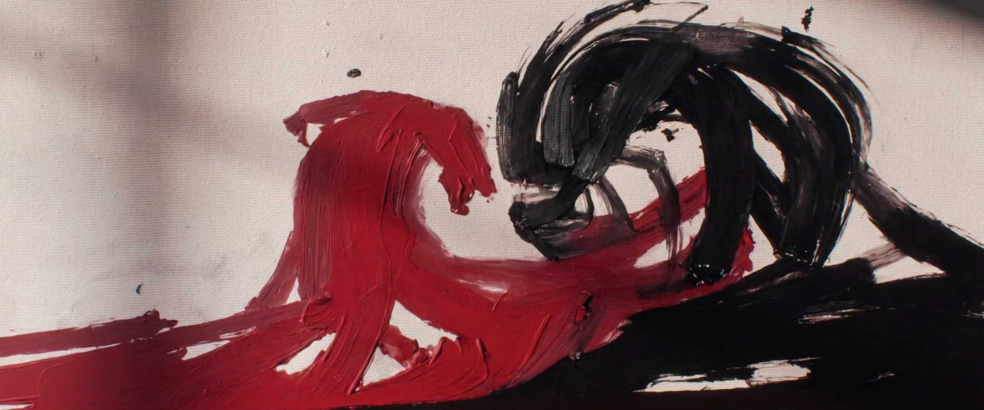 Abstract painting in the style of Ronnie Koff, featuring thick red and black paint strokes on a white canvas. Frame from Stash Magazine article.