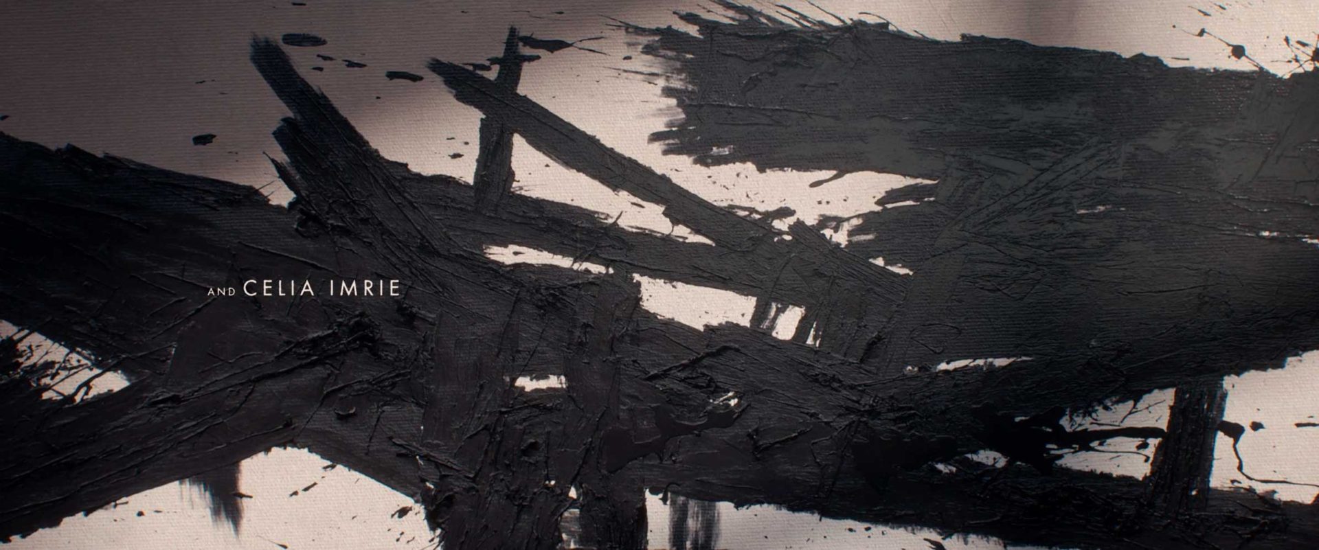 Black abstract brushstrokes by Ronnie Koff on a light background with the text AND CELIA IMRIE. Frame from Stash Magazine article.
