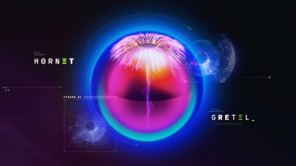 A glowing, colorful abstract sphere with radiating light at the center, labeled HORNET on the left and GRETEL on the right, set against a dark background with digital effects and SCAD CoMotion 2026 opening titles text. Frame from Stash Magazine article.