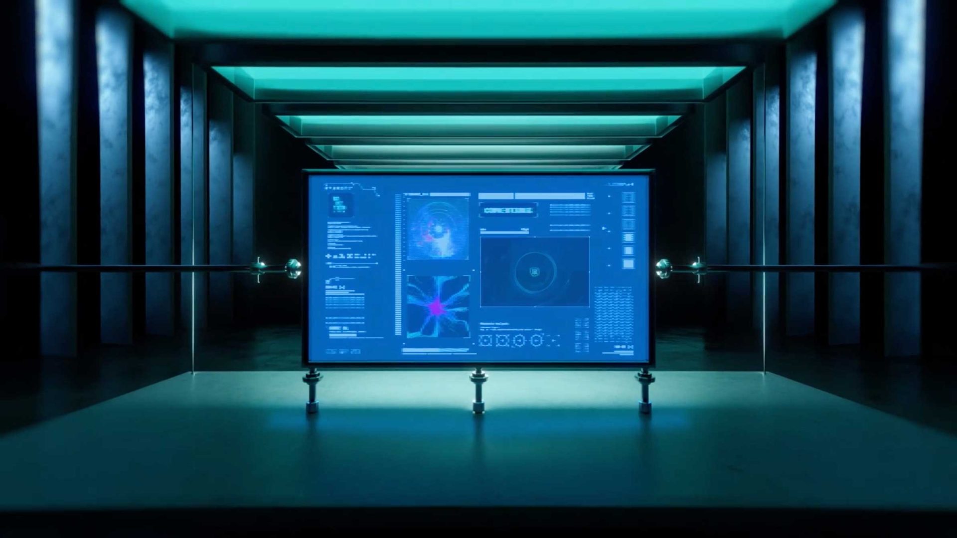 A large, futuristic digital screen displaying complex scientific data and graphics is centered in a dark room with glowing blue-green ceiling lights and a symmetrical, high-tech design—capturing the dynamic spirit of Energy in Flux at SCAD CoMotion 2026. Frame from Stash Magazine article.