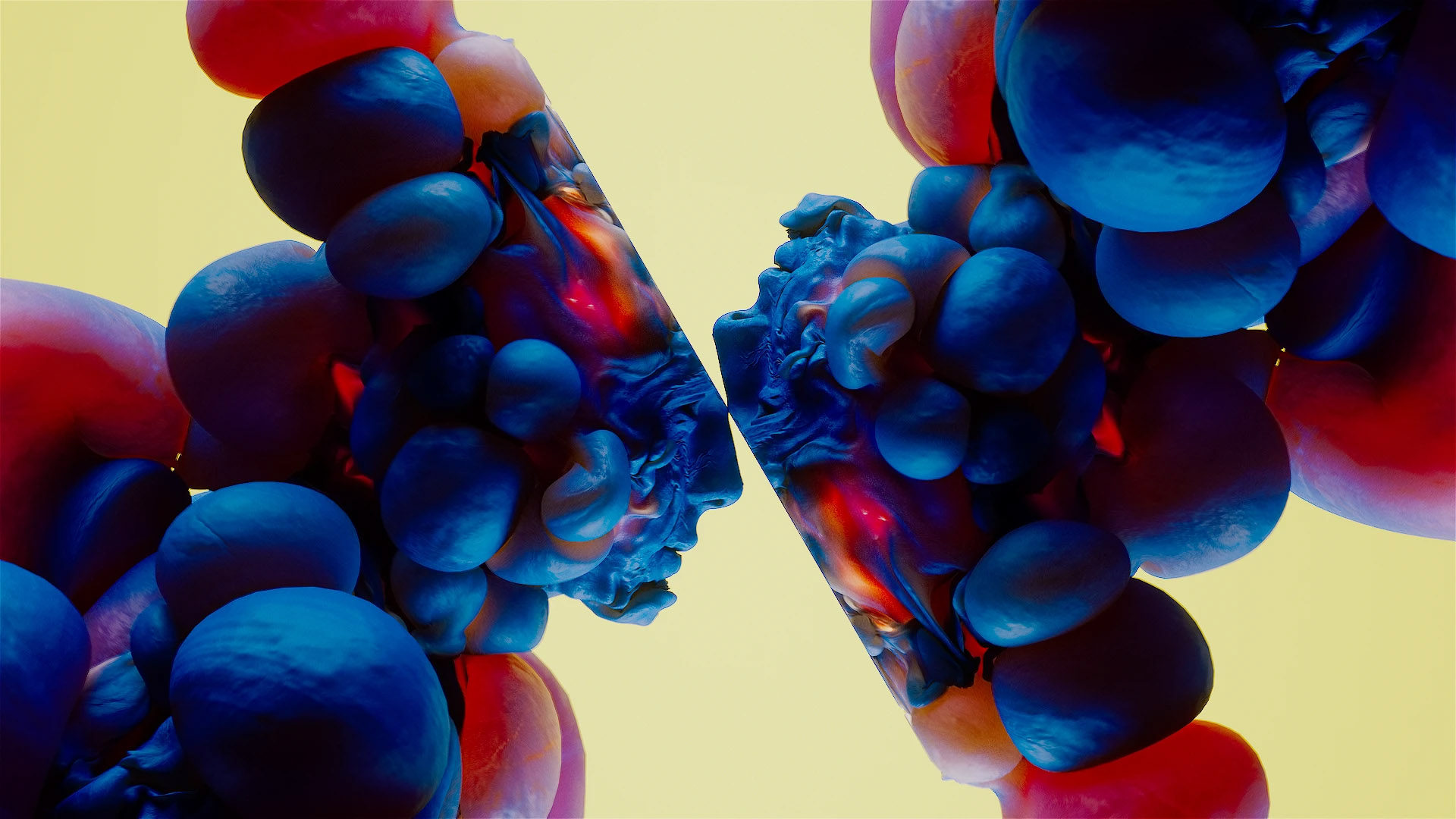 Abstract 3D shapes in red, blue, and purple cluster symmetrically against a pale yellow background, creating a mirrored, organic pattern in the center reminiscent of visuals from Kouhei Nakama’s short CG film SWELL. Frame from Stash Magazine article.