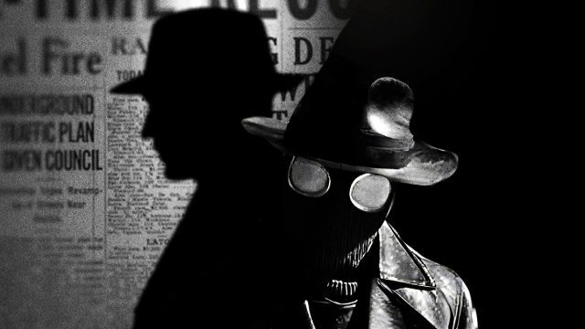 A figure in a trench coat, wide-brim hat, and mask with goggles stands in shadow, their silhouette cast on a newspaper-covered wall in the background—a scene reminiscent of the atmospheric Spider-Noir TV series opening titles by Digital Kitchen. Frame from Stash Magazine article.