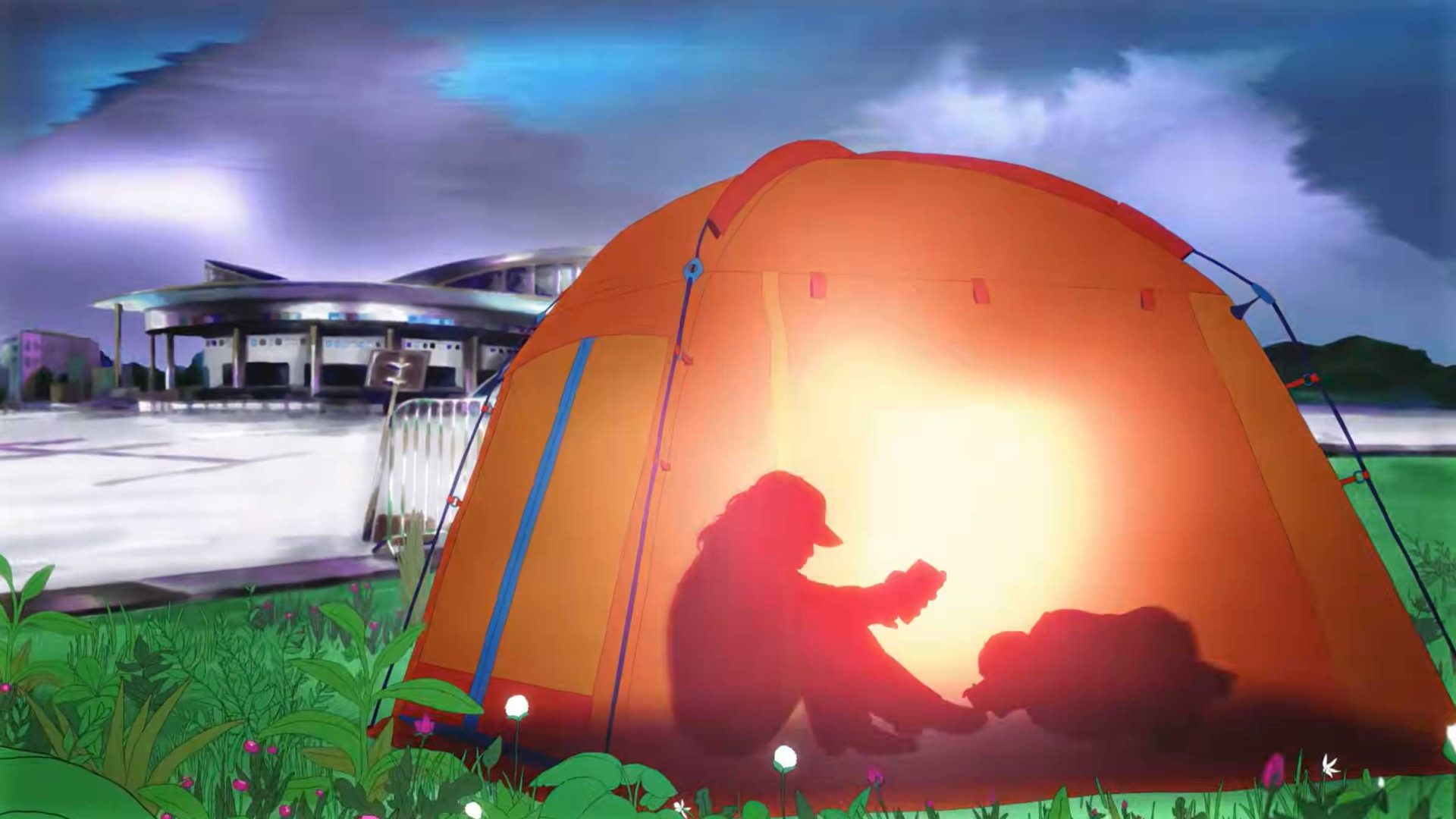 An orange tent is set up on grass with wildflowers, glowing from within and showing the shadow of a person reading. In the background, a modern building sits under a cloudy, twilight sky—like a scene from Spotify Reserved animated ad by Jocelyn Charles. Frame from Stash Magazine article.
