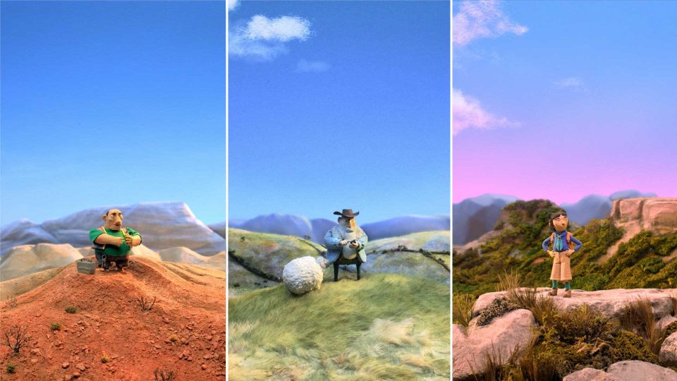 Three claymation figures, crafted by Catherine Prowse and Passion Animation for Telstra Satellite Messaging spots, stand in distinct landscapes: a man on a red hill, a cowboy beside a sheep on grass, and a woman atop a green mountain under a purple sky. Frame from Stash Magazine article.