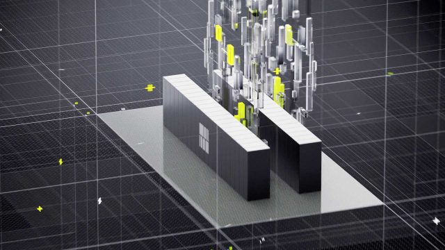 A 3D-rendered image of two black rectangular blocks with a white Microsoft logo, featured in the Tensordyne Math Power Product Film by Found Studio, surrounded by floating translucent and yellow geometric shapes on a gray grid-like surface. Frame from Stash Magazine article.