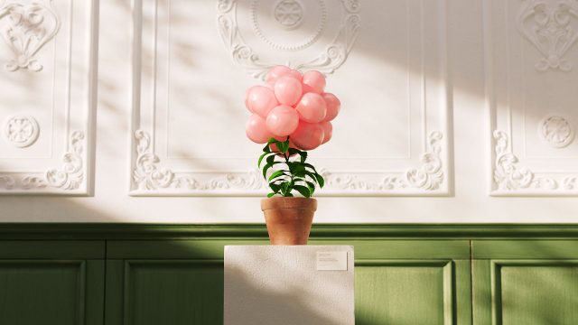 A potted plant with glossy green leaves topped by a pink balloon cluster, resembling a flower, sits on a pedestal against an ornate white and green wall—a whimsical scene reminiscent of The Sweet Performance of Bubblegum Plant short film by Sebastian Marek. Frame from Stash Magazine article.
