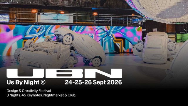 Art installation with three white, upside-down cars in a colorful, vibrant indoor space. A large mirror ball hangs overhead. Text overlay promotes UBN Design & Creativity Festival, September 24-26, 2026. Us By Night is a three-night design & creativity festival in Antwerp, Belgium. Frame from Stash Magazine article.