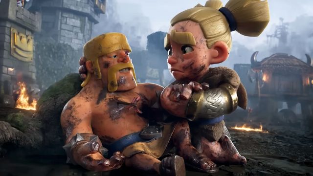 A dirty, injured cartoon warrior is comforted by a worried female fighter in armor. They sit on the ground amid a smoky, battle-damaged landscape with burning debris in the background, reminiscent of an intense Clash Royale scene. Frame from Stash Magazine article.