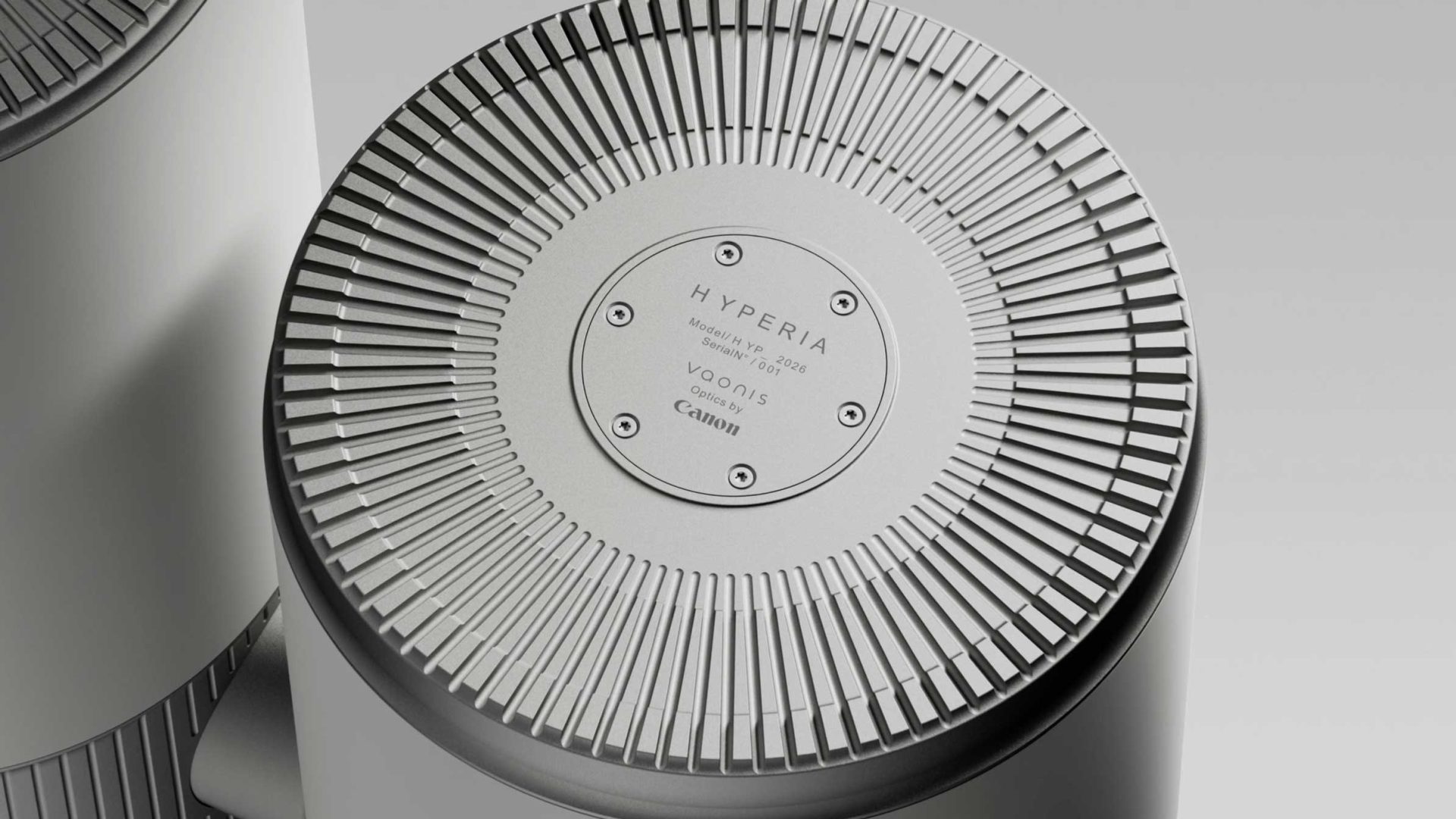 Close-up view of the top of the sleek Hyperia Telescope, labeled HYPERIA with branding from Vaonis and Canon, featuring a textured, radial pattern and a metallic finish. Frame from Stash Magazine article.